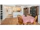 Bright dining area adjacent to the kitchen, with a checkered tablecloth and vintage decor at 801 83Rd N Ave # 215, St Petersburg, FL 33702