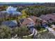 Overhead view of the property showing the home's backyard with a private pool and pristine landscaping at 8619 Foxtail Ct, Tampa, FL 33647