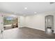 Large, airy room featuring sliding glass doors opening to the pool area and a view of the back yard at 8619 Foxtail Ct, Tampa, FL 33647