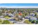 Aerial view of the home with a location pin, showcasing the neighborhood and distant waterfront views at 90 Huron Ave, Tampa, FL 33606