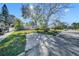 Quaint single story home with a large front yard shaded by mature trees at 90 Huron Ave, Tampa, FL 33606