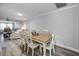 Dining area with light wooden table and white chairs at 9204 Golf View Dr, New Port Richey, FL 34655