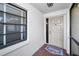 Inviting entryway with a new door and tile floor at 9204 Golf View Dr, New Port Richey, FL 34655