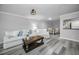 Bright living room with white couch, coffee table, and wood-look floors at 9204 Golf View Dr, New Port Richey, FL 34655