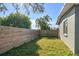 Fenced backyard with grass area and modern wood fence at 9893 111Th St, Seminole, FL 33772