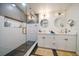 Modern bathroom with white subway tiles, a glass shower, and double vanity at 9893 111Th St, Seminole, FL 33772