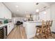 Modern kitchen with white cabinets, quartz countertops, and stainless steel appliances at 9893 111Th St, Seminole, FL 33772