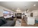 Modern living room with open concept kitchen and hardwood flooring at 9893 111Th St, Seminole, FL 33772