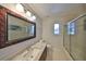 Bathroom with granite countertop and walk-in shower at 1011 Sonata Ln, Apollo Beach, FL 33572