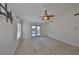 Bright bedroom featuring a ceiling fan and access to a balcony at 1011 Sonata Ln, Apollo Beach, FL 33572