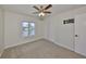 Bright bedroom with double-door closet and window at 1011 Sonata Ln, Apollo Beach, FL 33572