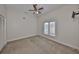 Spacious bedroom with a large window and ceiling fan at 1011 Sonata Ln, Apollo Beach, FL 33572