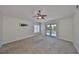 Spacious bedroom with balcony access and ceiling fan at 1011 Sonata Ln, Apollo Beach, FL 33572