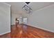 Spacious dining room with hardwood floors and modern light fixtures at 1011 Sonata Ln, Apollo Beach, FL 33572