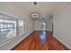 Bright dining room with hardwood floors and modern light fixtures at 1011 Sonata Ln, Apollo Beach, FL 33572