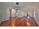 Bright dining room with hardwood floors and modern light fixtures at 1011 Sonata Ln, Apollo Beach, FL 33572