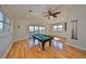 Game room with pool table and hardwood floors at 1011 Sonata Ln, Apollo Beach, FL 33572