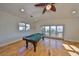 Game room with pool table and hardwood floors at 1011 Sonata Ln, Apollo Beach, FL 33572