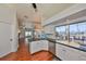 Modern kitchen with stainless steel appliances and a view to the pool at 1011 Sonata Ln, Apollo Beach, FL 33572