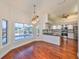 Modern kitchen with stainless steel appliances and pool views at 1011 Sonata Ln, Apollo Beach, FL 33572