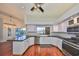 Updated kitchen featuring white cabinets, granite counters, and stainless steel appliances at 1011 Sonata Ln, Apollo Beach, FL 33572