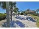 Enjoy waterfront views from this sandy picnic area, complete with shaded tables and grills at 1011 Sonata Ln, Apollo Beach, FL 33572