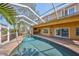 Inviting pool area with screened enclosure at 1011 Sonata Ln, Apollo Beach, FL 33572