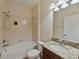 Clean bathroom with granite vanity and a tub shower combo at 11601 Mansfield Point Dr, Riverview, FL 33569