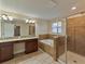 Bathroom with double vanity, soaking tub, and shower at 11601 Mansfield Point Dr, Riverview, FL 33569