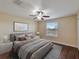 Bedroom with water view and hardwood floors at 11601 Mansfield Point Dr, Riverview, FL 33569