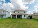 Two-story house with screened porch and yard at 11601 Mansfield Point Dr, Riverview, FL 33569