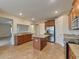 Open kitchen boasts stainless steel appliances and granite countertops at 11601 Mansfield Point Dr, Riverview, FL 33569