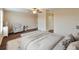 Main bedroom with sitting area and hardwood floors at 11601 Mansfield Point Dr, Riverview, FL 33569