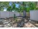 Spacious backyard with a fence, some trees, and a storage shed at 1201 77Th N St, St Petersburg, FL 33710