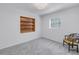 Spare bedroom with carpeted floors and built-in shelving at 1201 77Th N St, St Petersburg, FL 33710