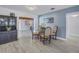 Bright dining room featuring a glass-topped table with striped chairs and a built-in hutch at 1201 77Th N St, St Petersburg, FL 33710