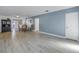 Spacious open concept living room with wood-look floors at 1201 77Th N St, St Petersburg, FL 33710