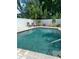 Sparkling private swimming pool surrounded by a white fence at 1201 77Th N St, St Petersburg, FL 33710