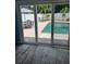 View of a private pool and patio area from inside the home, showing seamless indoor-outdoor living at 1201 77Th N St, St Petersburg, FL 33710