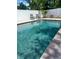 Sparkling private swimming pool surrounded by a white fence at 1201 77Th N St, St Petersburg, FL 33710