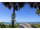 Charming view of a walkway to a beach with a sign reading 