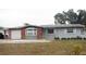 Ranch style home with brick and gray siding, and attached garage at 12361 114Th St, Largo, FL 33778