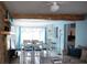 Living and dining area with light beige couch and white table at 12361 114Th St, Largo, FL 33778