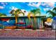 A brightly-colored storefront with surfboards, kayaks and a mural of a wave on the building at 12361 114Th St, Largo, FL 33778