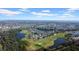 Aerial view of community, golf course and lake at 1252 Lyndhurst Greens Dr, Sun City Center, FL 33573