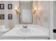 Elegant half-bath with updated fixtures and striped wallpaper at 1252 Lyndhurst Greens Dr, Sun City Center, FL 33573