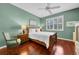 Charming bedroom with hardwood floors and a ceiling fan at 1252 Lyndhurst Greens Dr, Sun City Center, FL 33573