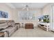 Relaxing living room featuring comfortable seating and large windows at 1252 Lyndhurst Greens Dr, Sun City Center, FL 33573