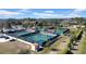 Aerial view of multiple pickleball courts with players and surrounding landscape at 1252 Lyndhurst Greens Dr, Sun City Center, FL 33573