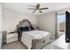 A relaxing bedroom features a ceiling fan and stylish furniture at 13182 Twin Bridges Dr, Riverview, FL 33579